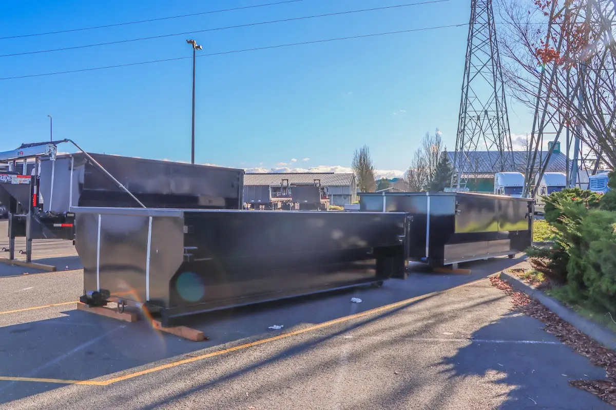 Roll-off dumpster ready for waste disposal at job site for 2 Yard Dumpster Rental in Pine Ridge